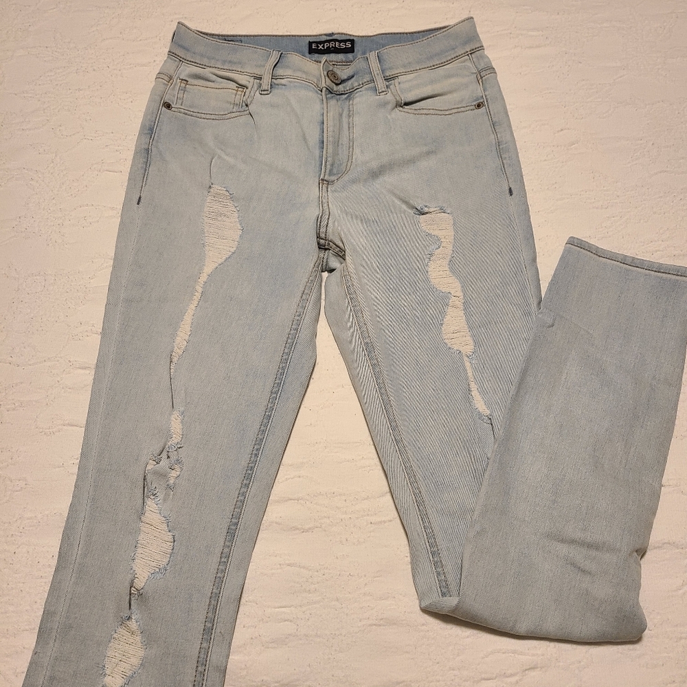 Size 4 distressed Express jean leggings in light wash
